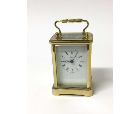 A Henley brass cased carriage clock and key with swing handle, retailed by Asprey, 14cm high including handle