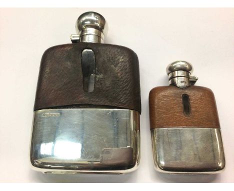 Silver mounted spirit flask and a smaller plated spirit flaskThe larger flasks cup appears stuck / glued to the body and cann