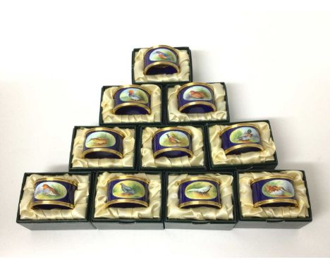 Collection of ten Graham Payne Studios Worcester hand decorated enamel napkin rings painted with British birds, together with