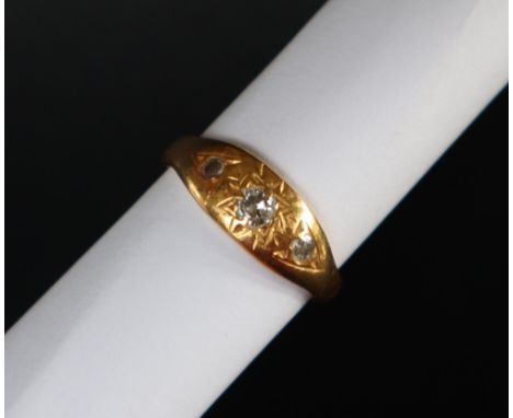 A 22ct gold ring set with three round old cut diamonds, size K, approximately 5 grams