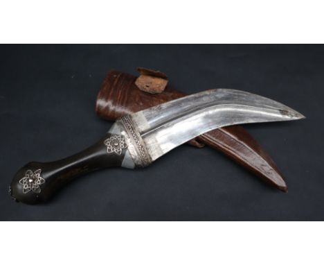 An Indian dagger Jambya with a curved double edge blade with raised central rib, horn hilt with white metal wirework decorati
