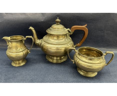 A George V silver three piece teaset, of squat circular form with leaf decoration on a spreading foot, Birmingham, 1927, Adie