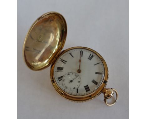 An 18ct yellow gold hunter pocket watch with an enamel dial, Roman numerals and seconds subsidiary dial, the movement with a 