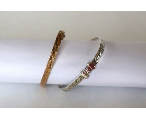 A 9ct yellow gold christening bangle, approximately 4 grams together with a silver christening bangle, approximately 5 grams