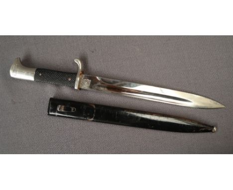 A World War II German bayonet with a fullered blade marked Original Eickhorn Solingen with a metal scabbard 