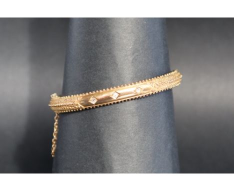 A 15ct yellow gold hinged bangle approximately 7 grams 