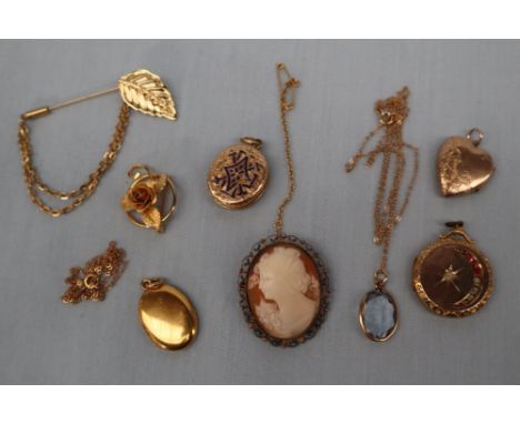 An Indonesian black opal together with a shell cameo brooch, four yellow metal lockets, paste set pendant, chains  etc 