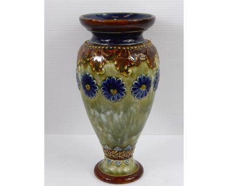 A Doulton Lambeth Ware Vase, cobalt floral highlights on green glaze, approx 18 cms high.