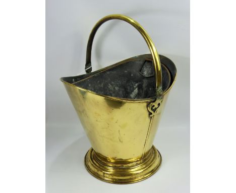 A Victorian Brass Helmet Coal Bucket, with original liner.