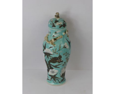 A Chinese Baluster Vase and Cover, turquoise glaze hand painted with white chrysanthemum, chasing dragons to the collar, appr