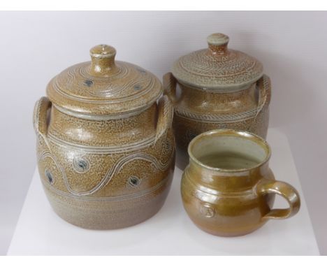 Roy Finch, A Collection of Winchcombe Pottery, including two storage jars and covers, together with a mug. (3)