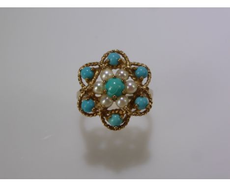 A Lady's 9 ct Yellow Gold Turquoise and Seed Pearl Ring. 1 x 4.5 mm, 6 x 3 mm turquoise and 6 x 2.8 mm seed pearls size N, ap