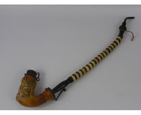 An Antique German Long Stem Pipe, the bowl with decorative carving depicting a stag, approx 49 cms.