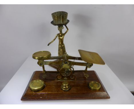 A Pair of English Brass Postal Scales, with weights together with a brass candle holder in the form of a tribal woman carryin