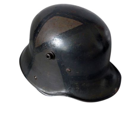 A German WWI M16 Camouflage Remscheid-Hasten Helmet, the helmet having leather sizing band and inscribed J. Muller, stamped K