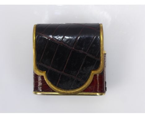 A Bric Lux of Paris Crocodile Skin Lighter, the lighter of envelope design with slide top, in working order.