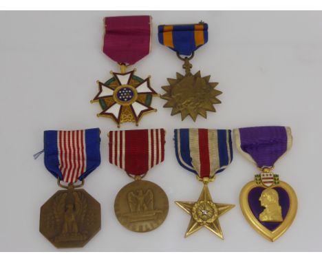 A Group of 6 American War Medals, including Legion of Merit, Purple Heart for Military Merit, Bronze Star for Gallantry in Ac