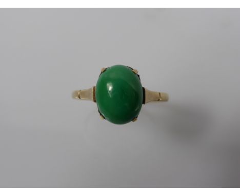 A Lady's 9 ct Yellow Gold Apple Green Jade Ring, jade 10 x 8 mm size R,  together with another 9 ct yellow gold blue stone ri