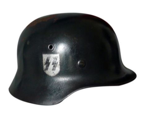WWII Waffen SS single decal helmet manufactured by Vereinigte Deutsche Nikelwerke. The helmet is stamped NS64 + DN84 and is c