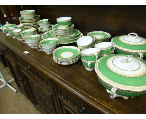 A Miscellaneous Collection of Crown Staffordshire, including three lidded tureens, three oval platters, eight dinner plates, 