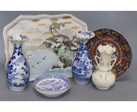 A Japanese Imari plate, two vases, a tray, a Belleek vase and two saucers tallest 21cm