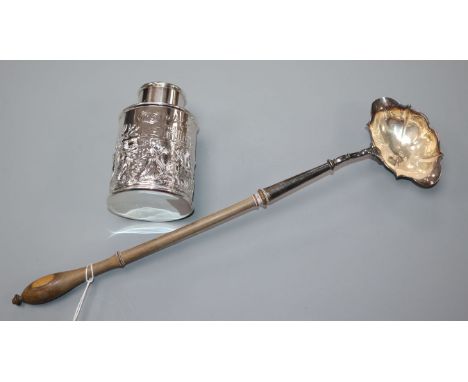 A George II silver toddy ladle by David Hennell I, London, 1749 and a late Victorian silver tea caddy.
