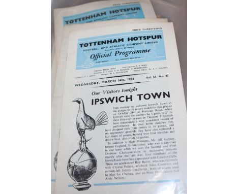 A large collection of Tottenham Hotspur memorabilia including programmes, official season handbooks, ticket stubs and a rattl