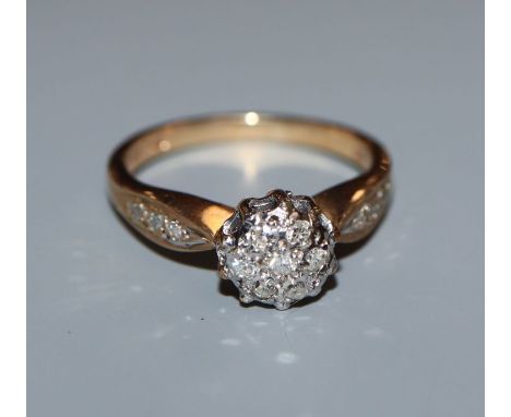 A 9ct gold diamond cluster ring, total diamond weight approximately 0.20cts, size K.