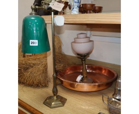 A green glass and brass desk lamp, another lamp and a copper bowl