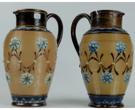 Pair of Royal Doulton Lambeth jugs decorated with light blue flowers height 18cm (lid missing from one) (2)