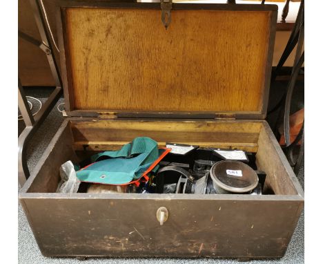 A vintage wooden box and contents, including a British rail signalling lamp, box size 64 x 34 x 28cm.