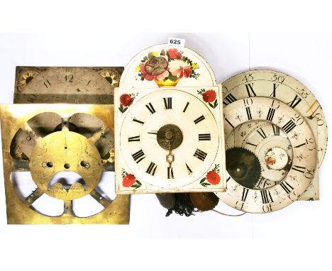 A Victorian wall mounted and painted wooden dial clock (H.35cms. )together with a group of clock faces.