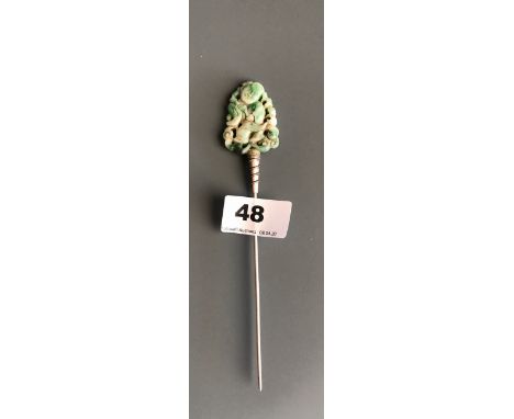 An early 20thC carved jade panel of a child with an acrobatic ribbon re-mounted as a hair ornament. L. 17.5cms. Condition of 
