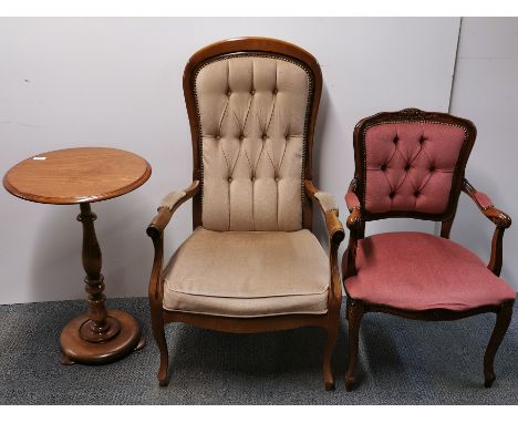 Two button back chairs and a circular side table.