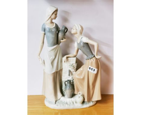 A large porcelain double Nao figure of two girls beside a spring, H. 39cm.