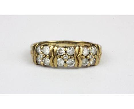 A 9ct yellow gold ring set with two rows of brilliant cut diamonds, (P.5).
