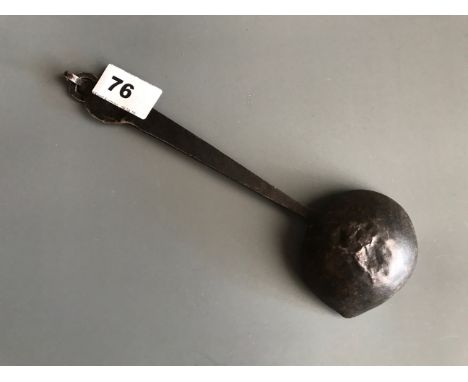 An 18th/ 19thC Tibetan hammered steel ladle used for yak butter candles and lamps. L. 24cm. Condition good for age. Slight cr