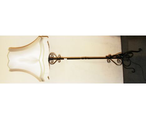 A vintage wrought iron standard lamp and silk shade, overall H. 180cm.