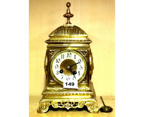 An early 20th century brass mantle clock with enamelled dial stamped Fritz (F) Marti, H. 29cm. Condition : mising pendulum, m