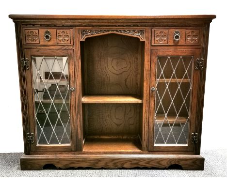 A carved oak and leaded glass display cabinet, 120 x 28 x 100cm.