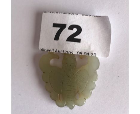 A small carved double sided jadeite jade butterfly pendant. H. 3.7cms. Condition good.