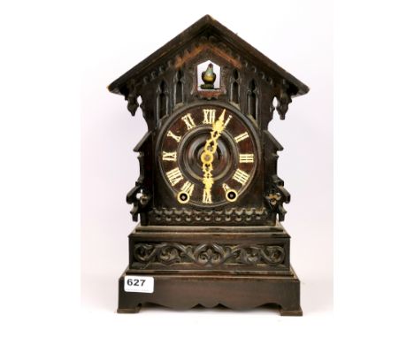 An early carved wooden Black Forest mantle cuckoo clock, H. 39cm. Condition - Requires attention.