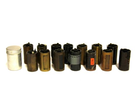 A group of fourteen Ernst Leitz Leica 35mm film cassettes.