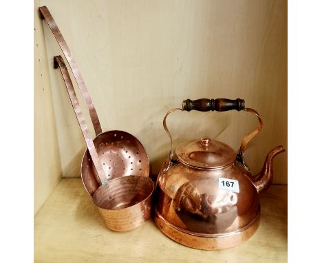 A copper kettle and ladle.
