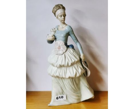 A large porcelain Nao figure of a girl with a hat, H. 34cm.