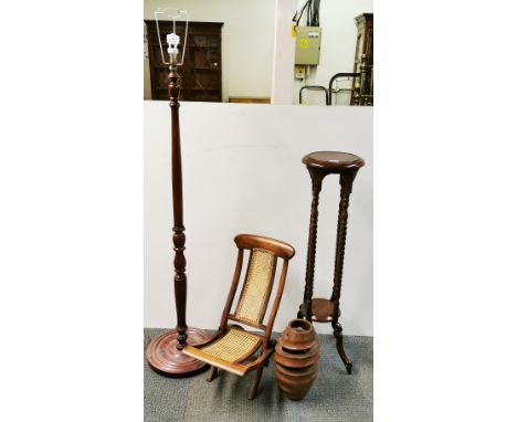 A mahogany plant stand, folding child's chair, wooden sculpture and standard lamp.