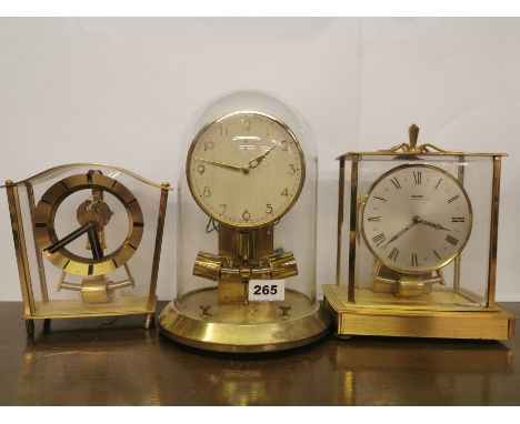 Three vintage magnetic pendulum clocks with battery electric movements, with glass dome, tallest overall H. 26cm. Condition -