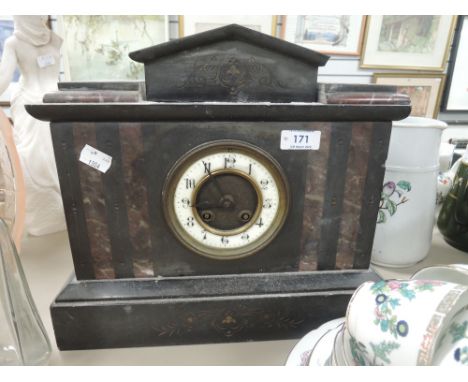 An impressive antique mantle clock with slate body 