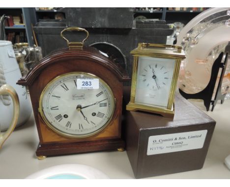 A mantle clock and carriage clock by Comitti