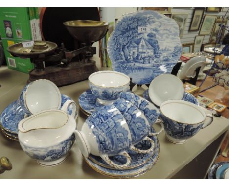 A part tea service by Sutherland China in the Rural Scenes design